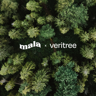 tree background with mala x veritree text overlay